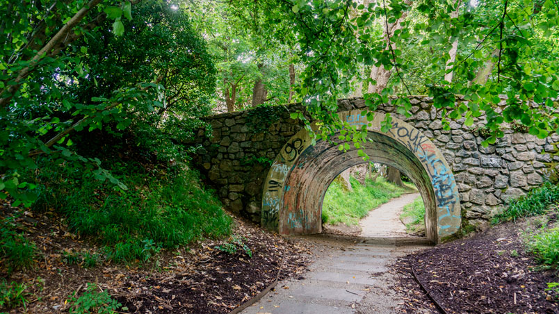 A path under a bridge in the Cristina Enea park