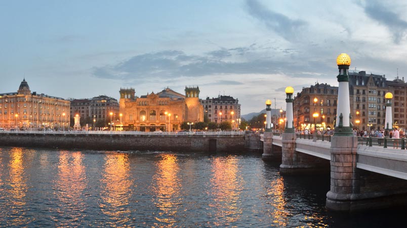 Sunset view of the Victoria Eugenia Theatre and Kursaal Bridge